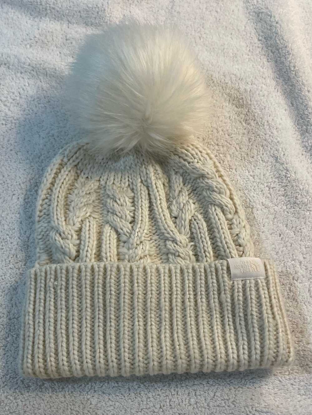 THE NORTH FACE ivory cable knit winter hat with Pom Pom